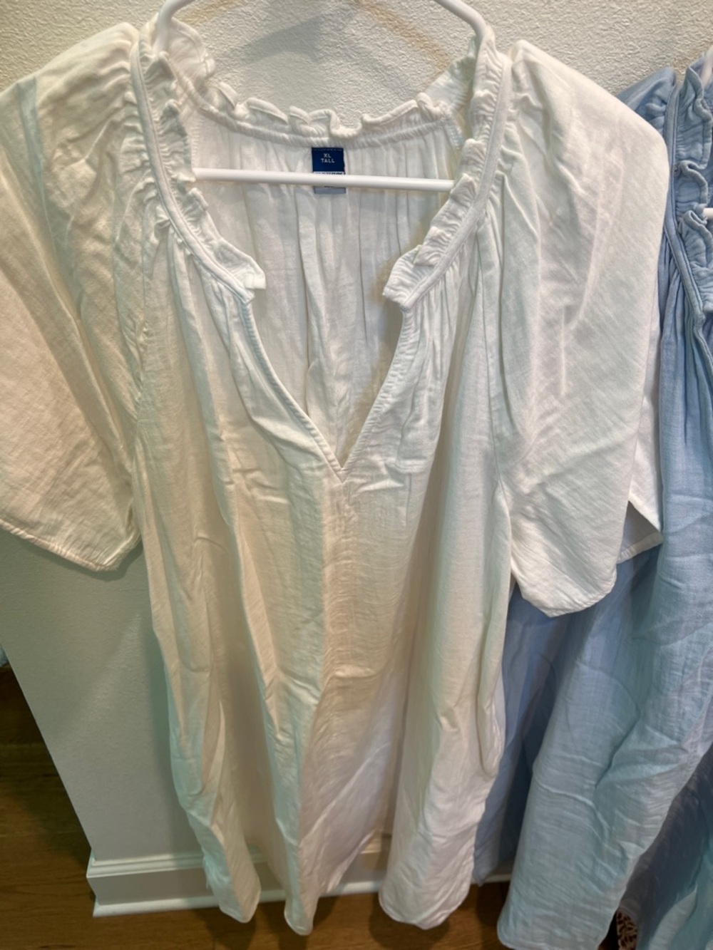 White Ruffled V-Neck Cotton Tunic and a baby
Blue ruffled V-Neck cotton dress